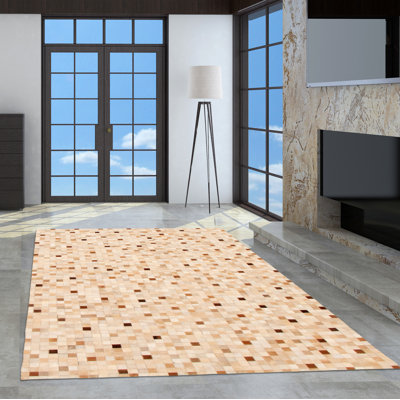 Tapis beige en peau de vache Hawarth