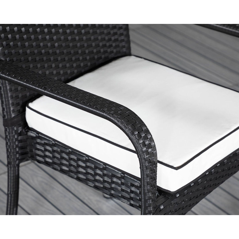 Flaherty 4 - Person Patio Dining Set with Rectangular Table , Cushions Included, Black/Vanilla
