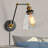 Annariitta 1-Light Industrial Wall Lamp with Antique Brass Finish for Bedroom Reading
