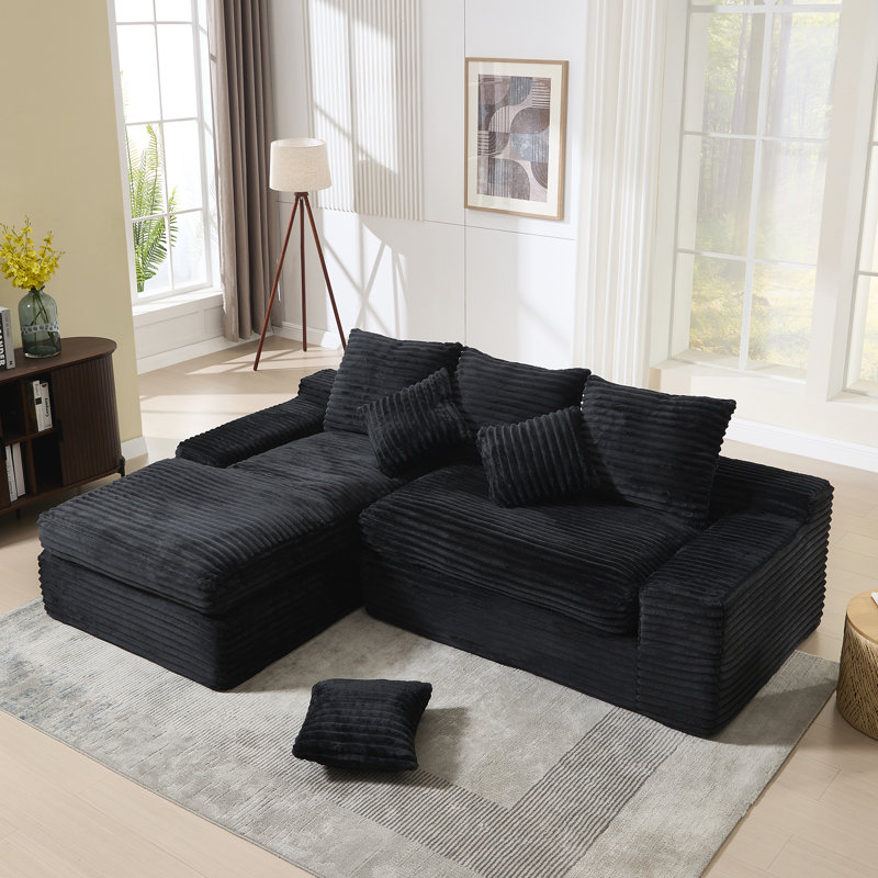Canapé modulaire en L spacieux et modulaire en tissu noir pour le salon