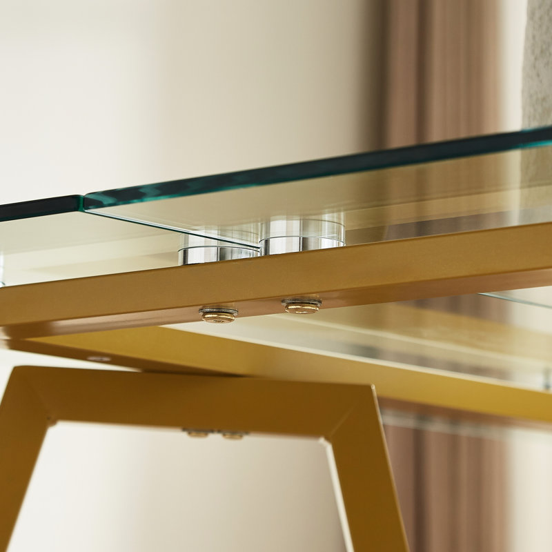 Table de salle à manger Boykin en verre doré moderne avec surface lisse, pieds en métal et pieds coulissants, idéale pour une utilisation contemporaine
