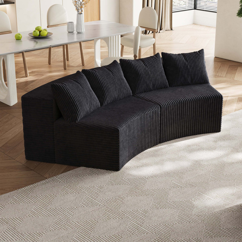 Canapé modulaire incurvé confortable avec quatre coussins, idéal pour diverses pièces, Noir