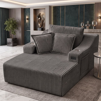 Chaise longue rembourrée en fausse fourrure avec porte-gobelets et coussins