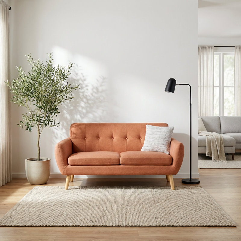 Causeuse capitonnée à boutons avec revêtement gaufré et pieds fuselés en bois, Orange brûlé