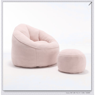 Fauteuil à billes en mousse haute pression avec repose-pieds rembourré pour un confort et une polyvalence ultimes dans n'importe quelle pièce