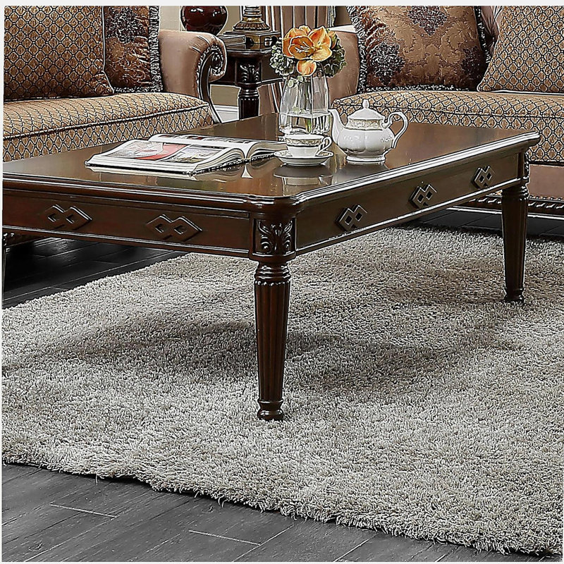 Table basse avec pieds pivotants réglables
