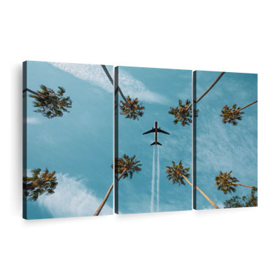 "Air plane au-dessus de palmiers" sur toile
