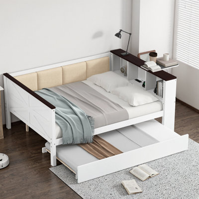 Lit de jour blanc avec tablettes de rangement, station de charge USB, dossier rembourré et lit gigogne blanc