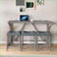 Ensemble de table basse et de chaises industrielles 4 pièces, panneau de fibres à densité moyenne aspect bois, peu encombrant et facile à nettoyer