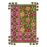 Tapis tissé à franges vert et rose