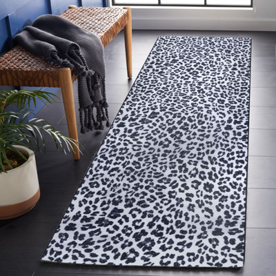 Tapis à imprimé animal ivoire / noir