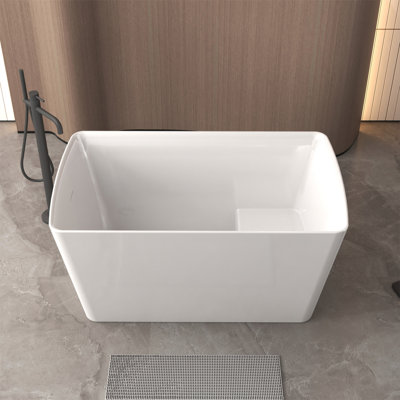 Baignoire autoportante de 47 po en acrylique avec siège: forme rectangulaire spacieuse, finition blanc brillant, trop-plein invisible et bonde escamotable chromée