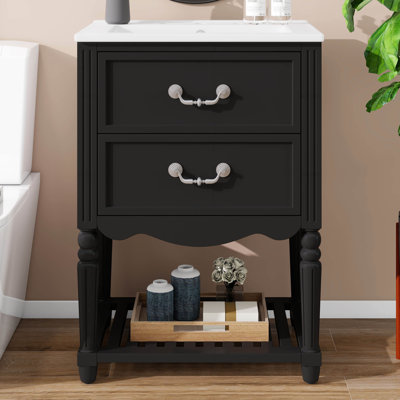 Meuble-lavabo de 24 po avec lavabo en céramique, armoire munie de deux tiroirs à fermeture en douceur et d'une tablette ouverte, mettant en valeur l'élégance rétro