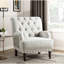 Chaise de luxe beige avec garniture cloutée, rembourrage en mousse et fabrication en contreplaqué de bois massif avec coussins de dossier et de siège attachés
