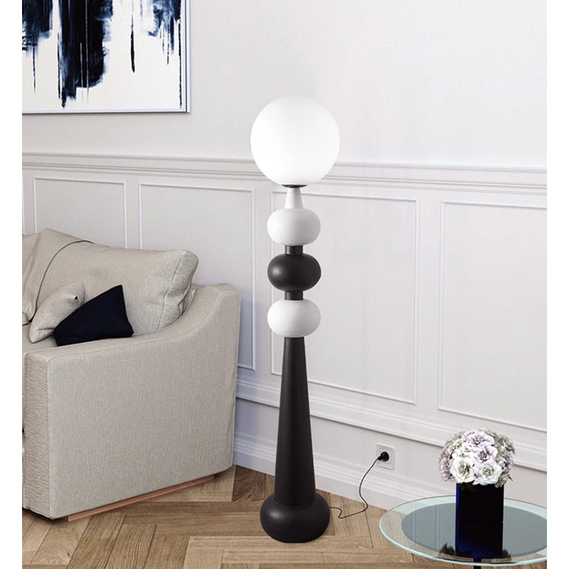Simple and Modern Floor Lamp with Glass and Wrought Iron Elements.