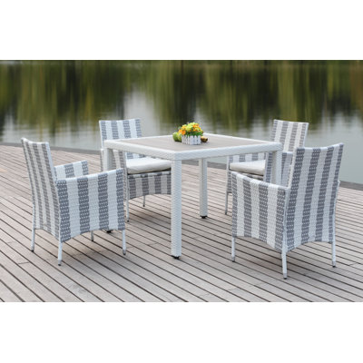 Thorntown 4 - Person Wicker Patio Dining Set with Square Table , Cushions Included