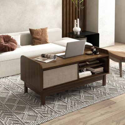 Table basse Ebern Designs avec porte coulissante et étagère réglable