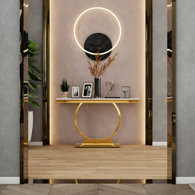 Console de luxe avec base en U en métal et plateau à texture brillante