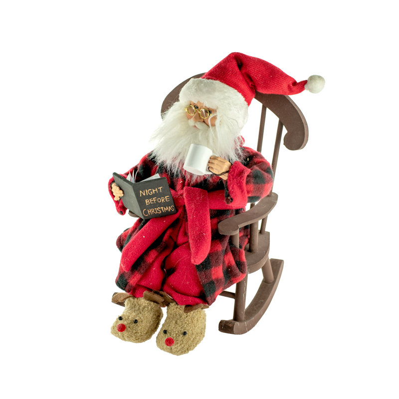 Père noël en fauteuil à bascule assis bedtime