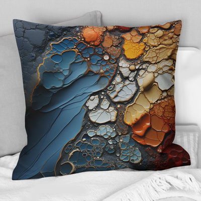 Coussin décoratif bleu et orange à motif de formes abstraites