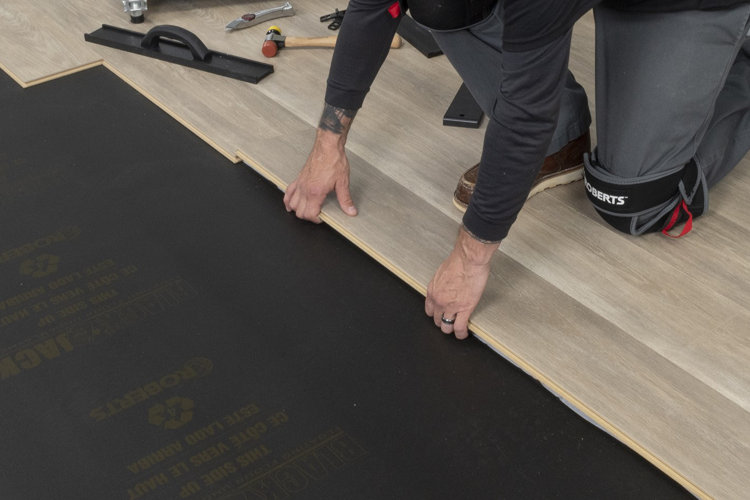 Image depicting how to install laminate flooring with click-lock joints.