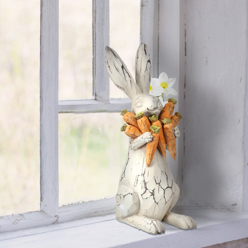 Lapin sculpté en résine avec carottes