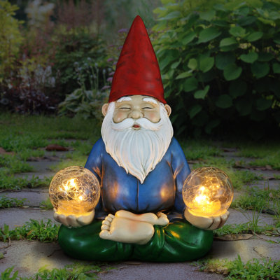 Statue solaire gnome tenant deux boules craquelées