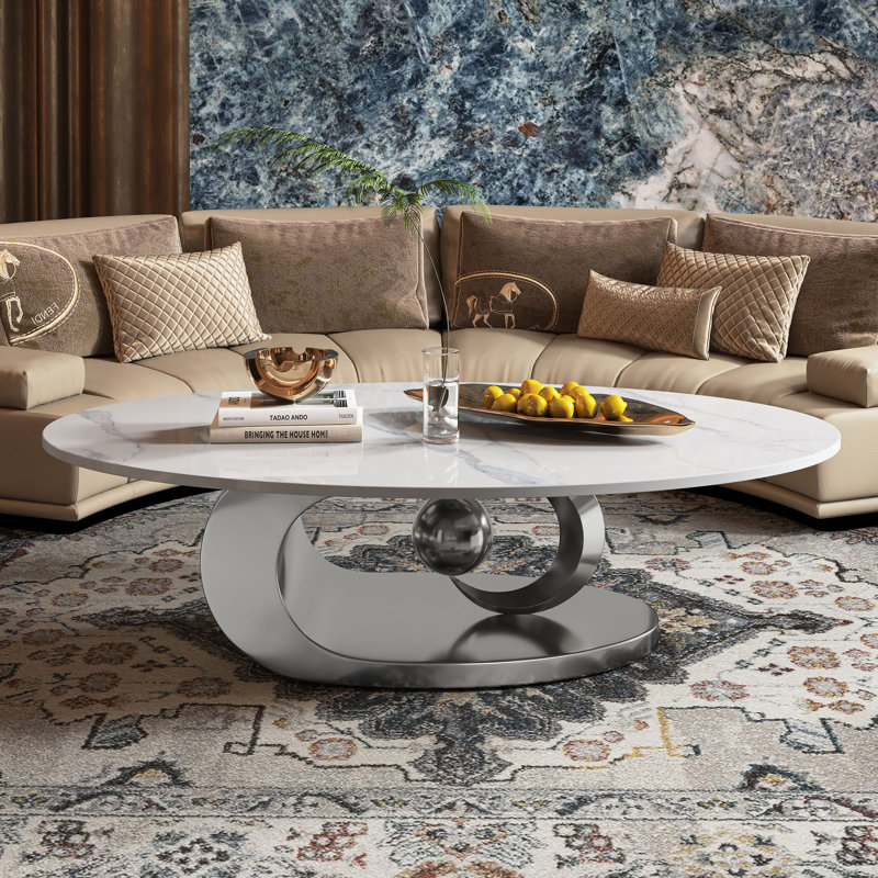 49.2" Oval Coffee Table with Faux Marble Top, Silver Stainless Steel Base with Abstract Fantastic Midsize Sphere Crescent-Shaped Design
