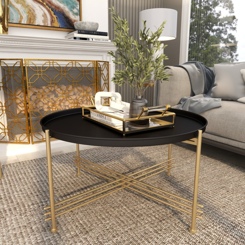 Table basse à plateau en métal noir avec base en X dorée