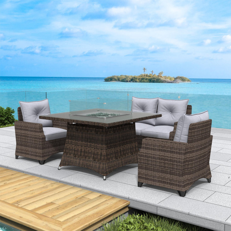 Schwerin Wicker 4 - Person Patio Conversation Set with Cushions