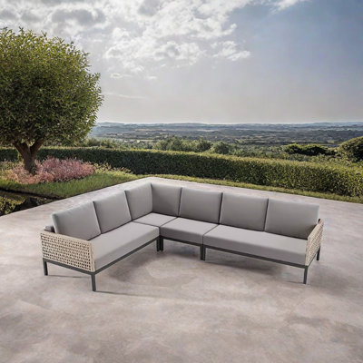 Bryia 102.36'' Wide L-Shaped Wicker Patio Sectional with Cushions