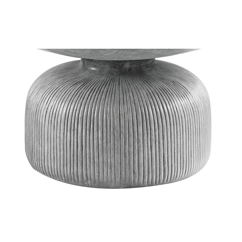 Table basse en ciment avec plateau rond gris délavé et base piédestal stable