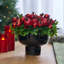 Christmas Crown of Pomegranates & Red Ornament Balls with Boxwood in Black Pedestal Holiday Fruit Bowl Centerpiece Arrangement