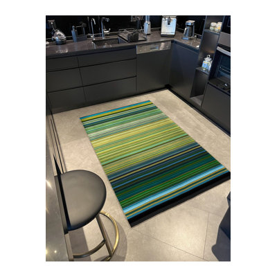 Tapis vert tissé à rayures