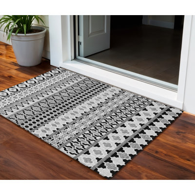 Tapis intérieur / extérieur lavable quadrilobe 3 pi x 5 pi noir et ivoire