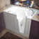 Flagstaff 52'' x 29'' Walk-in Fiberglass Bathtub with Faucet