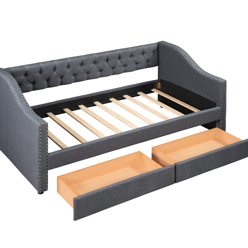 Élégant lit de jour rembourré gris avec deux tiroirs pour une base simple et stable de style maison