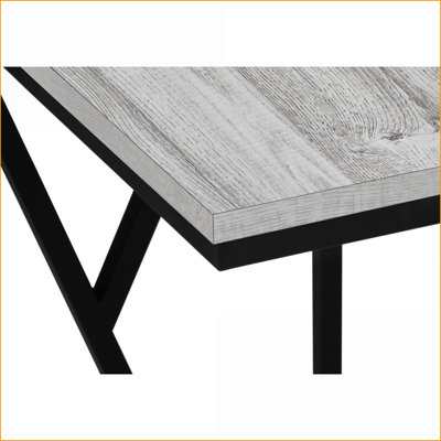 Table basse gain de place en stratifié noir et métal, en forme de C, idéale pour les collations près du canapé, style contemporain