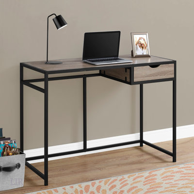 Bureau d'ordinateur compact et contemporain avec tiroir de rangement, idéal pour les petits bureaux à domicile et les espaces de travail modernes.