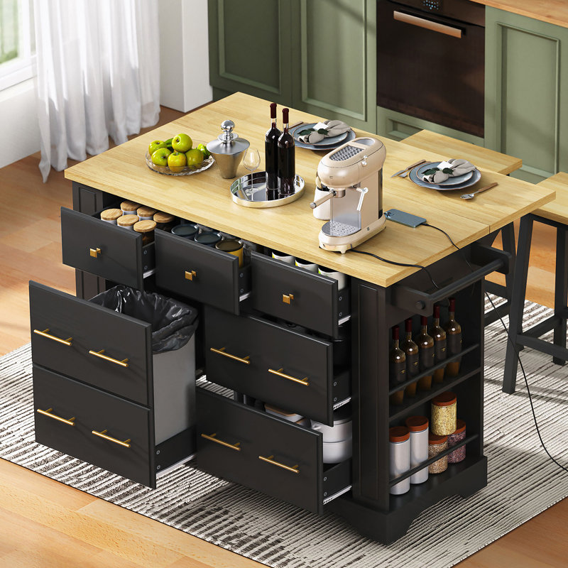 Versatile Rolling Kitchen Island With 6 Drawers, Pull-Out Trash Can Compartment, Drop-Leaf Countertop, Built-In Power Outlet, And 5 Hidden Lockable Wheels For Flexible Cooking And Storage.
