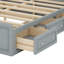Lit plateforme en bois massif avec tiroirs de rangement sous le lit, peu encombrant, sans sommier tapissier