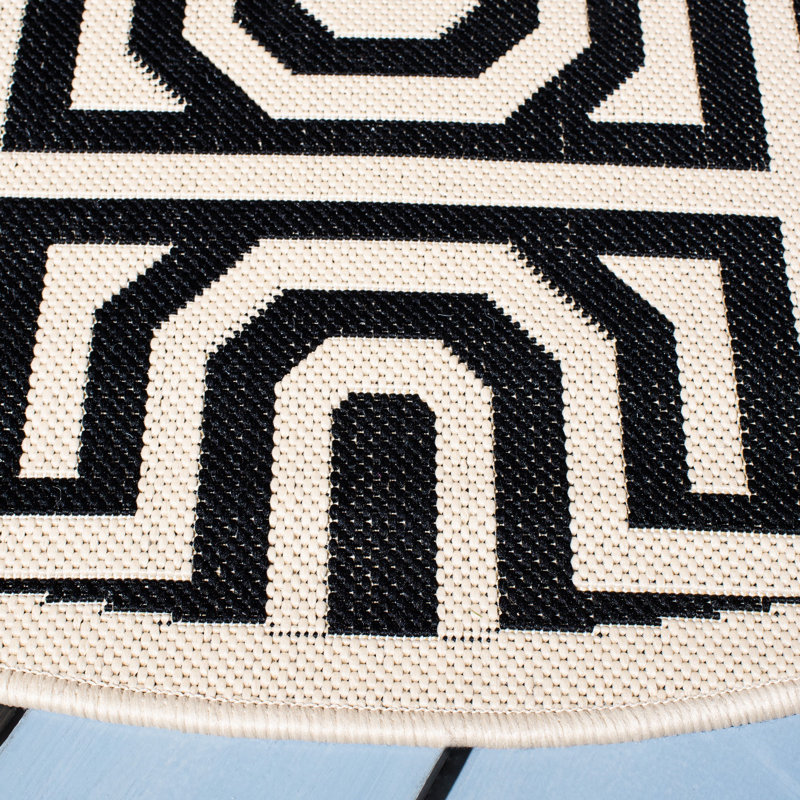 Tapis intérieur / extérieur sable / noir Arneshia, Rond 6 pi 7 po