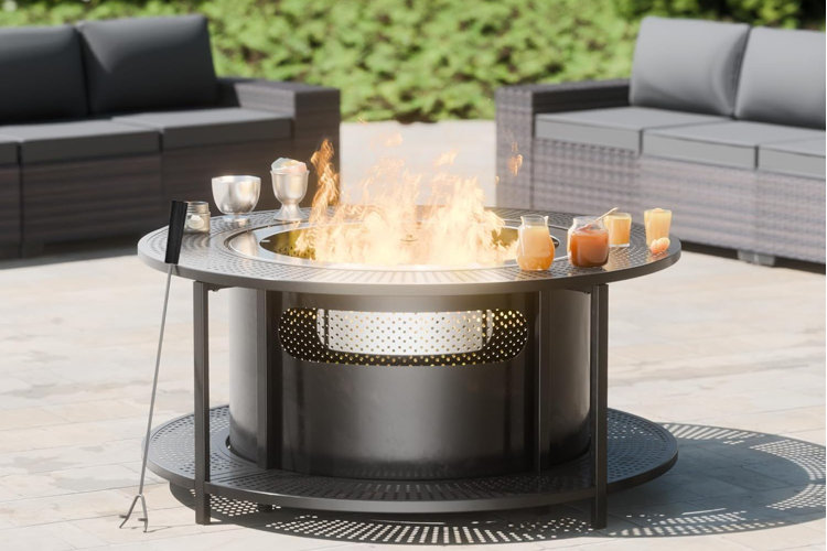 metal smokeless fire pit with two gray wicker patio sofas