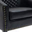 Fauteuil demi-tonneau capitonné en similicuir noir Edvardas-1431932706