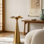 Table à boissons ronde en acier de 24 po de hauteur avec base fuselée, table d'appoint minimaliste moderne pour le salon et la chambre à coucher - Finition dorée