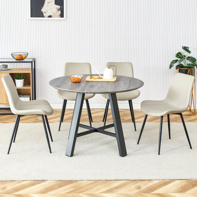 Ensemble de table de salle à manger moderne et minimaliste avec 4 chaises en polyuréthane gris clair et coussins incurvés