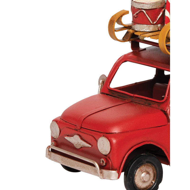 Figurine de voiture rouge avec bagage