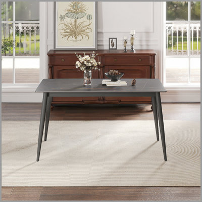 Table de salle à manger moderne en pierre artificielle avec pieds en métal noir, conception élégante pour six personnes, facile à nettoyer et durable