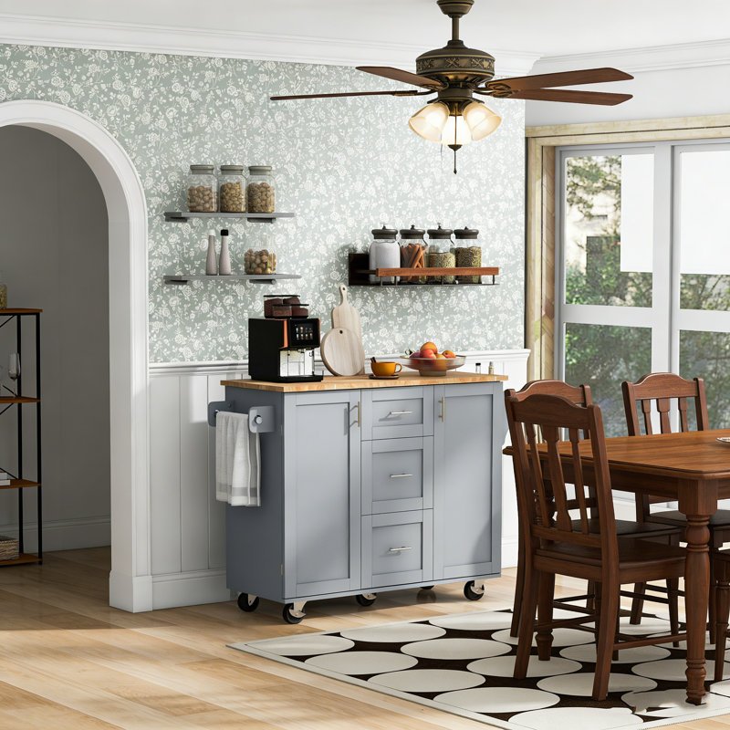Rolling Kitchen Island with Storage, Rubber Wood Top, 3 Drawers, Slide-Out Shelves, and Internal Racks for Organized Cooking Spaces.