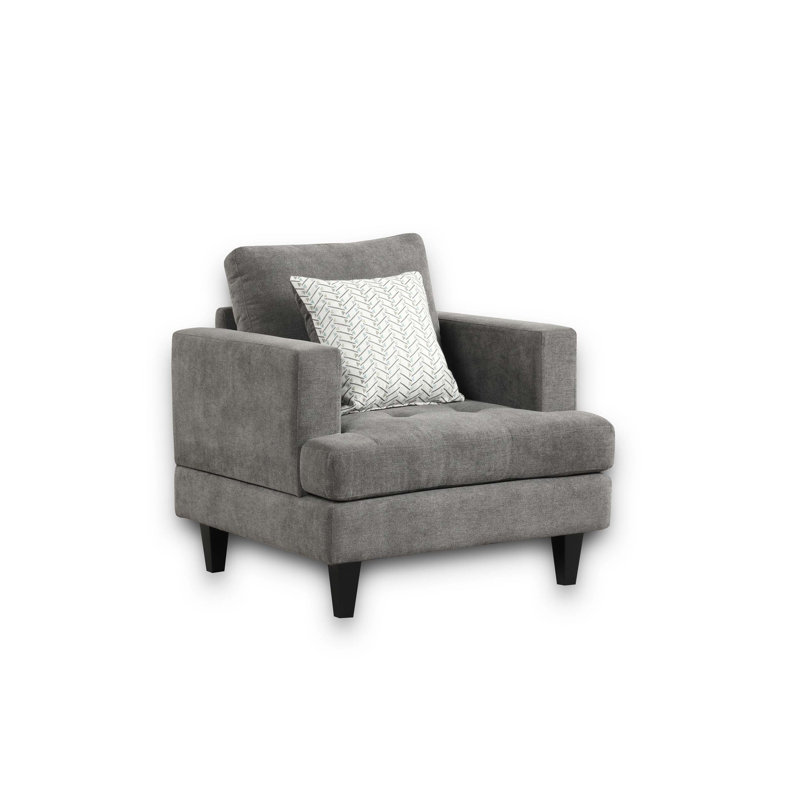 Chaise en chenille avec coussin décoratif, offrant un confort et un style inégalés pour des moments de détente dans n'importe quelle pièce.